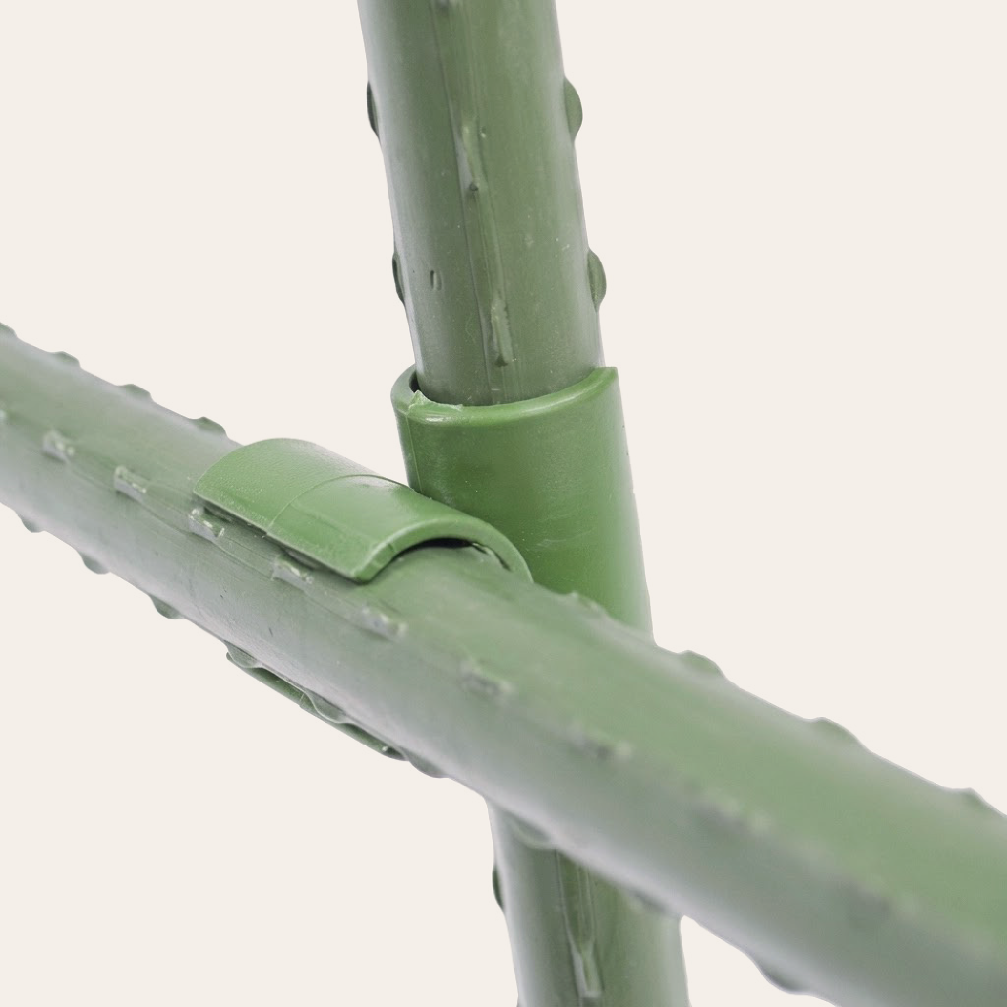 Custom plant cage built using flexible connectors and garden stakes